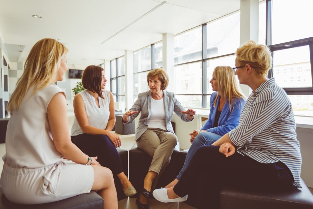 group-of-women-in-radically-open-dialectical-behavior-therapy-session-seated-in-circle